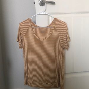 yellow shirt with white stripes